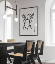 Load image into Gallery viewer, Line art style print artwork in a dining room with a black line illustrating a woman undressing.